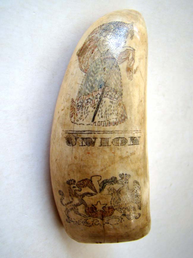 A 19th century scrimshawed polycome decorated whale's tooth featuring LADY LIBERTY, UNION and a family or regimental crest circa 1860.